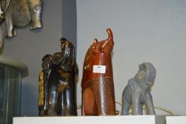 Three Elephants Including One Lantern