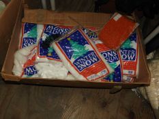 Box Containing Various Bags of Artificial Snow