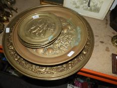 Nine Embossed Brass Trays