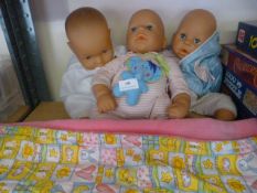 Three Dolls and a Baby Blanket