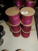 *Six Rolls of Purple Sequins