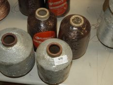 *Two Grey and Two Brown Rolls of Thread