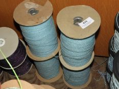 *Four Rolls of Pale Blue Braided Thread