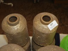 *Four Cones of Metallic Yarn