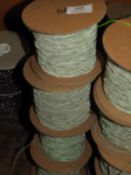 *Four Rolls of Pale Green Braided Thread