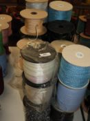 *Thirty Four Rolls of Assorted Ribbon and Braid Ed