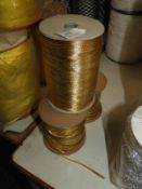 *Three Rolls of Gold Ribbon and Thread