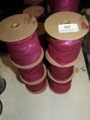 *Six Rolls of Purple Sequins