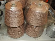 *Four Rolls of Salmon Coloured Metallic Knitting Y