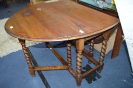 Oval Oak Drop Leaf Dining Table on Barley Twist Le