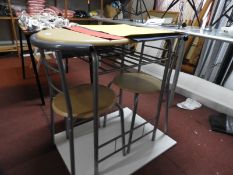 *Oval Table and Two Tubular Framed Chairs