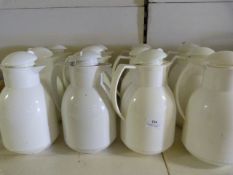 Twelve White Thermos Jugs