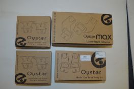 *Four Boxes of Oyster Carrycot Adapters etc.