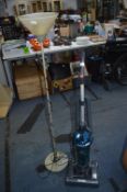 Vortex Upright Vacuum Cleaner and a Standard Lamp