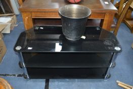 Smoked Glass TV Stand and a Brass Effect Waste Bin