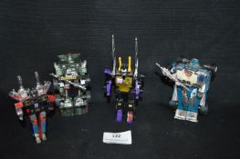 Four Diecast Transformers