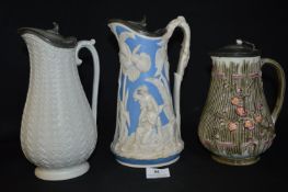 Three Victorian Ewers with Pewter Lids