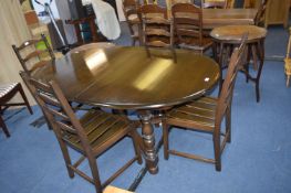 Dark Oak Oval Dining Table with Four Chairs