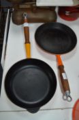 Two Le Creuset Cast Iron Frying Pans (Orange and Y
