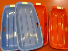 Four Plastic Sledges