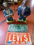 *Two Plaster Figurines and Two American Number Plat