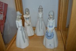 Four Pottery Figurines of Young Ladies