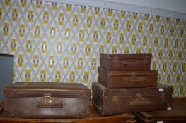 Four Vintage Suitcases
