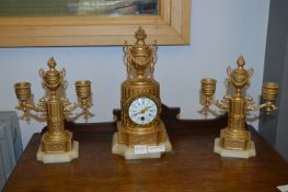 French Gilt Mantel Clock and a Pair of Candlestick Garnitures