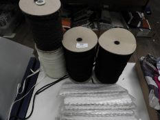 *Two Rolls of Black Cord, Roll of Ribbon and a Rol