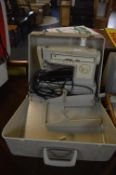 Singer Vintage Electric Sewing Machine in Carry Ca