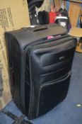 Large Pull Along Suitcase Containing Ladies Clothi