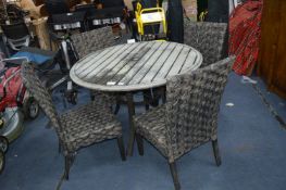 *Woodard Woven Outdoor Dining Table and Four Chairs