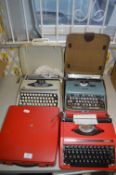 Three Portable Typewriters