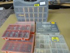 Seven Plastic Storage Boxes and a Quantity of Nuts