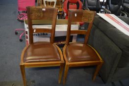 *Two Hardwood Dining Chairs with Butterfly Design