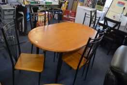 Oval Dining Table with Six Wrought Iron Effect Cha