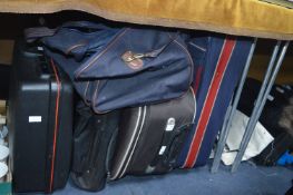 Three Suitcases and Two Holdalls