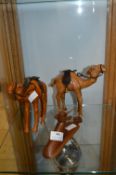Carved Wooden Camels and an Antelope