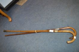 Two Walking Canes (One with Silver Band)