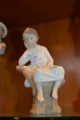 Lladro Figurine - Boy on Tree Stump