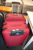 Pair of Red Wheeled Suitcases