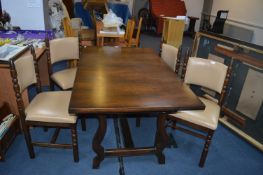 Dining Table and Four Upholstered Chairs