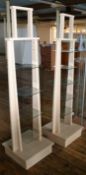 A Pair Of Tapered Retail Display Units With Glass Shelves - Dimensions Of Each: H186 x 50 x 50cm