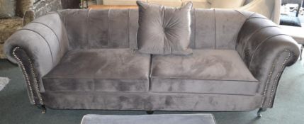 1 x Luxurious Dark Grey Plush Velvet 3 Seater Sofa. A perfect piece for lighting up your home and ad
