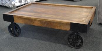 1 x Unique Vintage Style Low Coffee Table. This mobile coffee table sits on 4 metal wheels and has a
