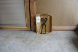 A pair of coal tongs
