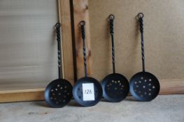 Set of cast iron warming spoons