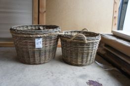 A pair of log baskets