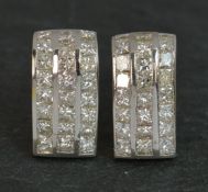 A stunning pair of Diamond and 18ct Gold earrings