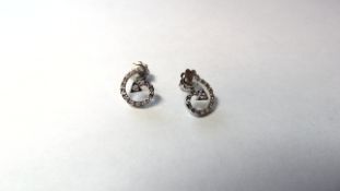 Stamped 750 Diamond Swirl Stud Earrings